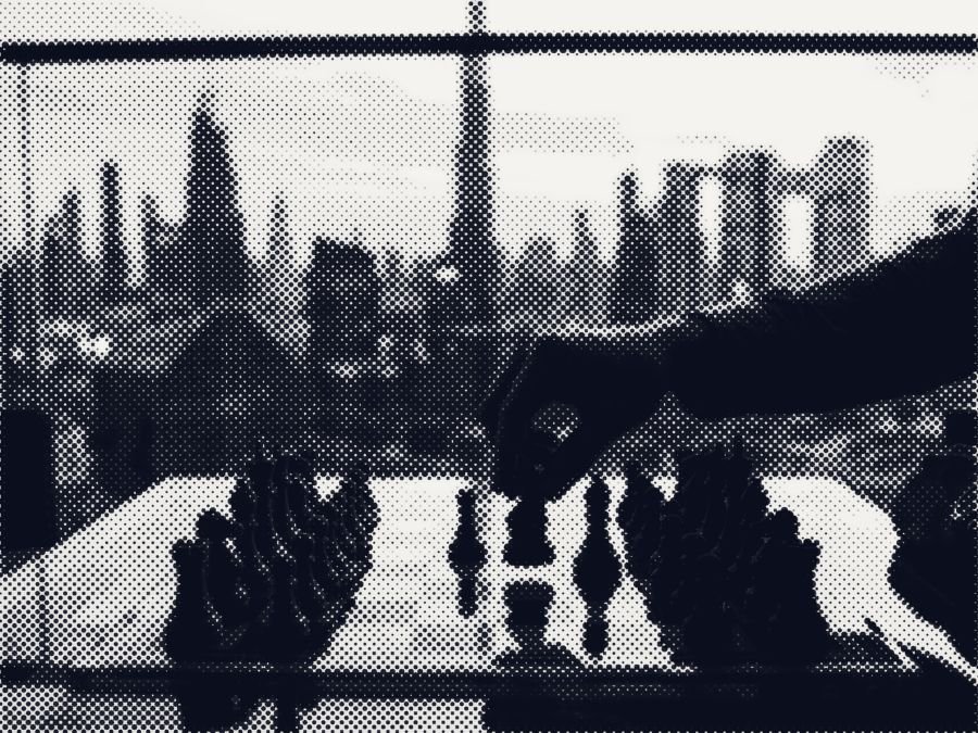 A hand moving a chess piece on a glass table